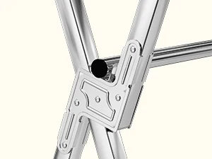 Nutshell stainless steel clothes drying rack close up of X frame joint and horizontal drying bar for hanging laundry