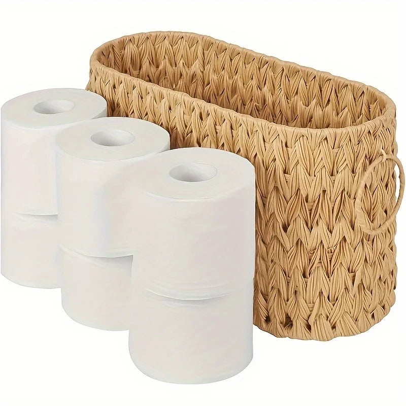 Natural wicker toilet paper holder basket with three rolls of white toilet paper for bathroom organization