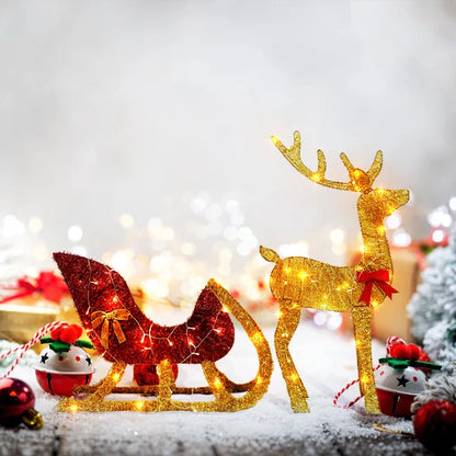 LED reindeer and sleigh outdoor Christmas decoration with sparkling lights on a snowy background