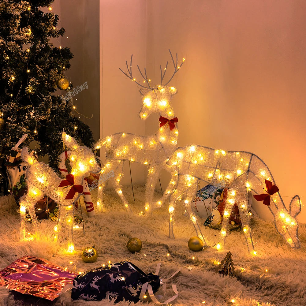Lighted deer Christmas outdoor decoration with festive bows and glowing lights for holiday display