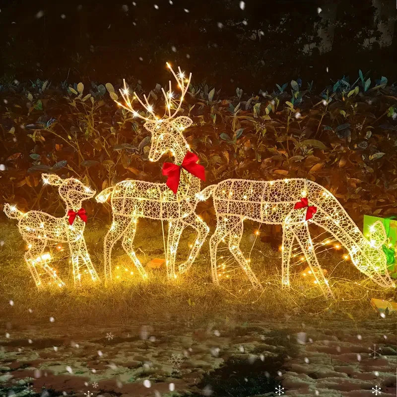 Lighted deer Christmas outdoor decoration featuring three reindeer with festive bows and twinkling lights
