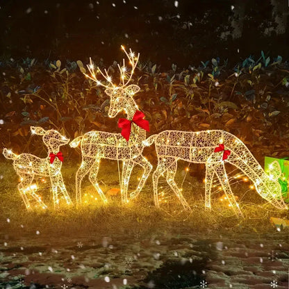 Lighted deer Christmas outdoor decoration featuring three reindeer with festive bows and twinkling lights