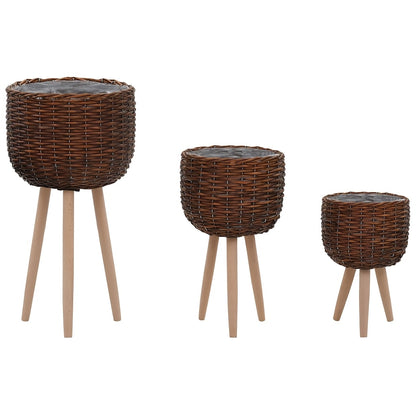 Set of three brown lined plater baskets on wooden legs for stylish plant display