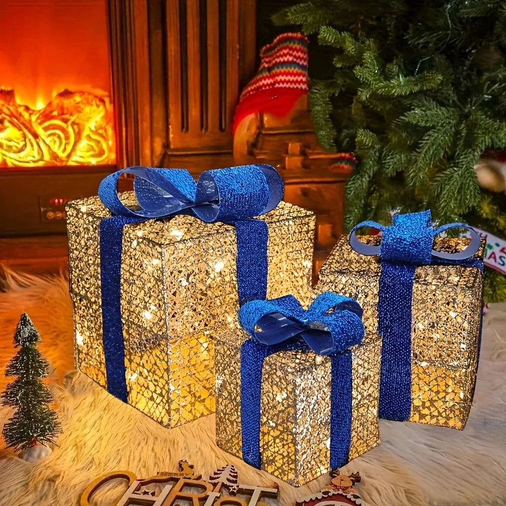 Luminous Christmas gift box decorations in gold and blue with glowing lights for festive holiday displays