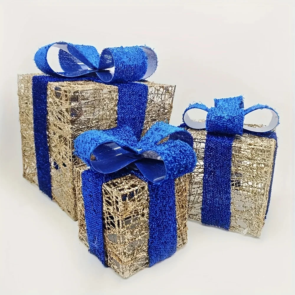 Luminous Christmas gift box decorations in gold and blue with shimmering ribbons for holiday presents