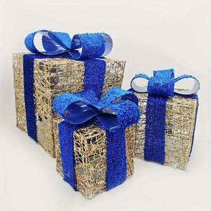 Luminous Christmas gift box decorations in gold and blue with shimmering ribbons for holiday presents