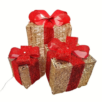 Set of three luminous Christmas gift box decorations in red and gold with festive bows