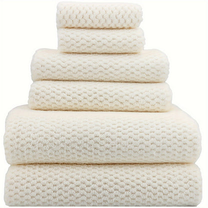 Nutshell luxury bath towel set in soft cream with various sizes for a plush bathroom experience