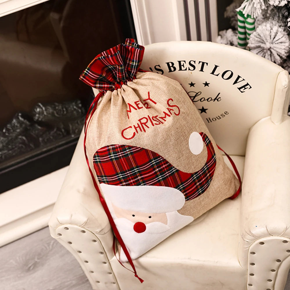 Luxury linen Christmas gift sack featuring Santa design and plaid drawstring for festive gifting