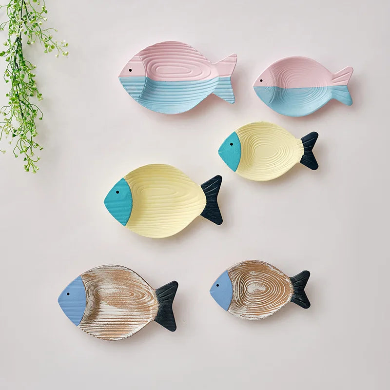Nutshell Mediterranean style home decor featuring colorful fish-shaped wall ornaments for a coastal theme
