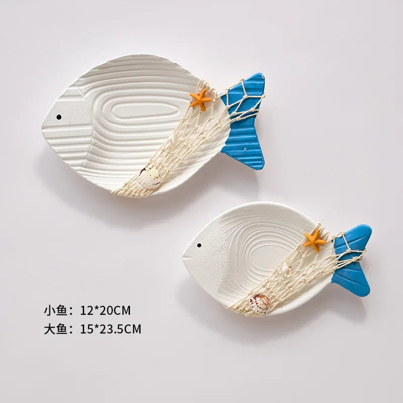Decorative fish-shaped ornaments in white and blue, perfect for Mediterranean style home decor