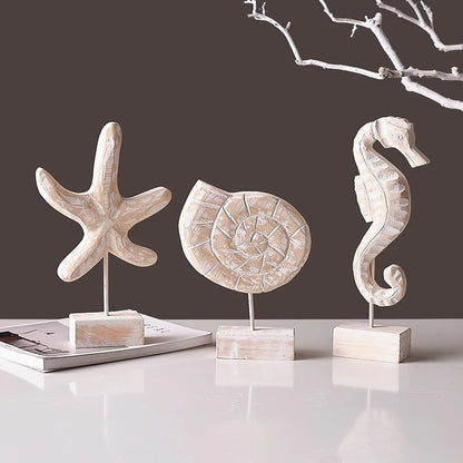 Set of three decorative ornaments in Mediterranean style home decor featuring a starfish, seashell, and seahorse