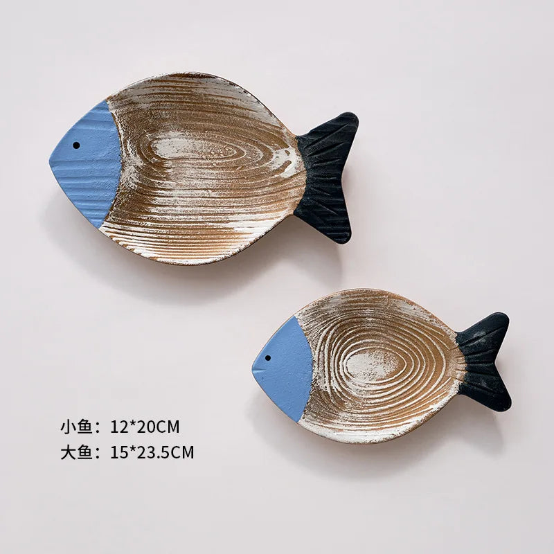 Nutshell wooden fish ornament set for Mediterranean style home decor. Includes two sizes with natural wood finish.
