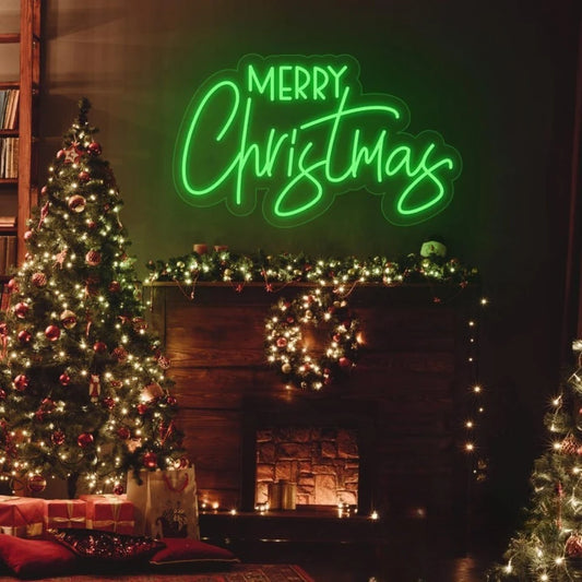 Merry Christmas neon sign glowing above a festive Christmas tree and decorated fireplace
