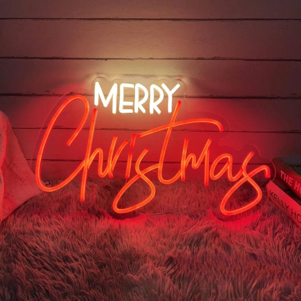 Merry Christmas neon sign glowing in red on a cozy textured surface