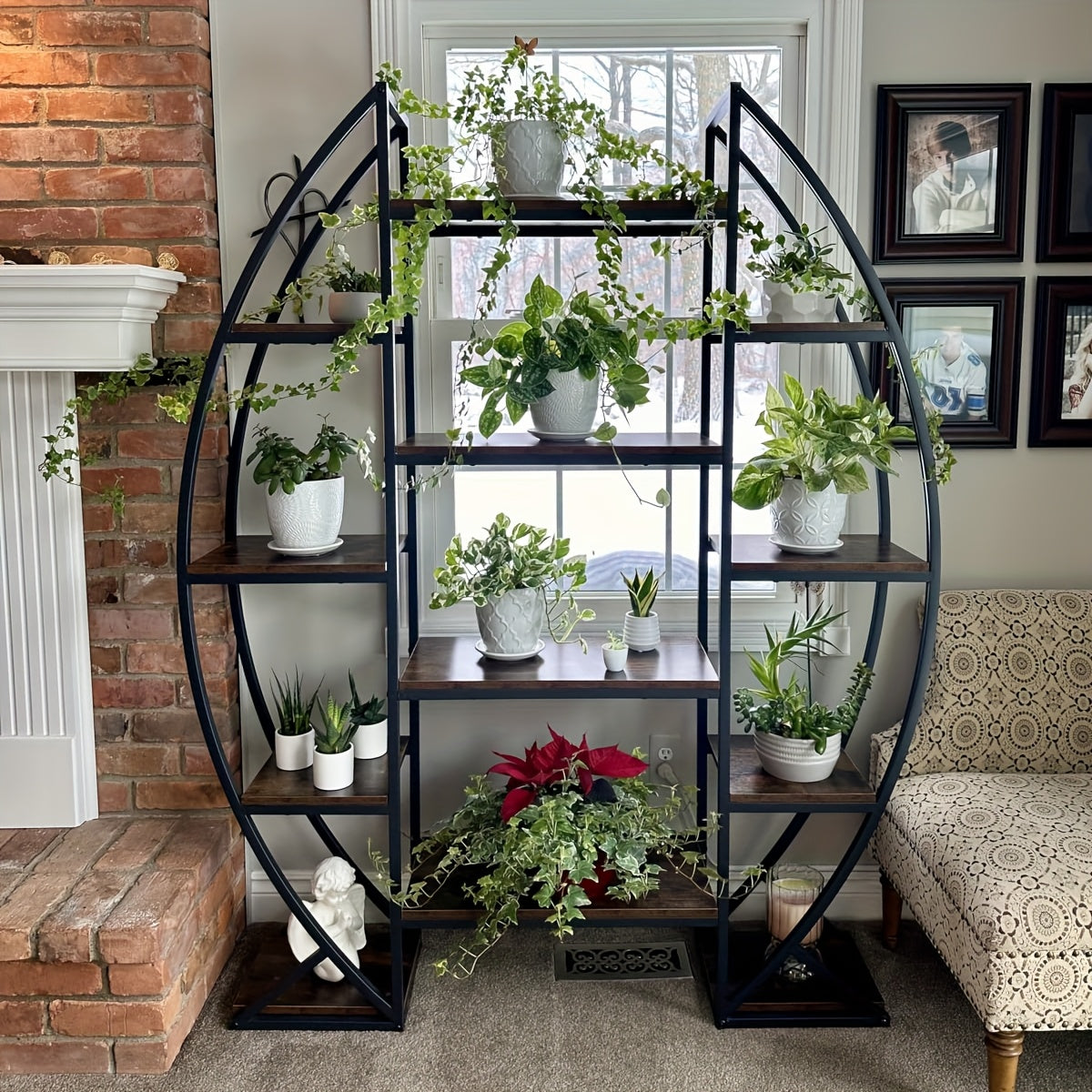 Nutshell metal curved display shelf with multiple tiers showcasing decorative plants and greenery