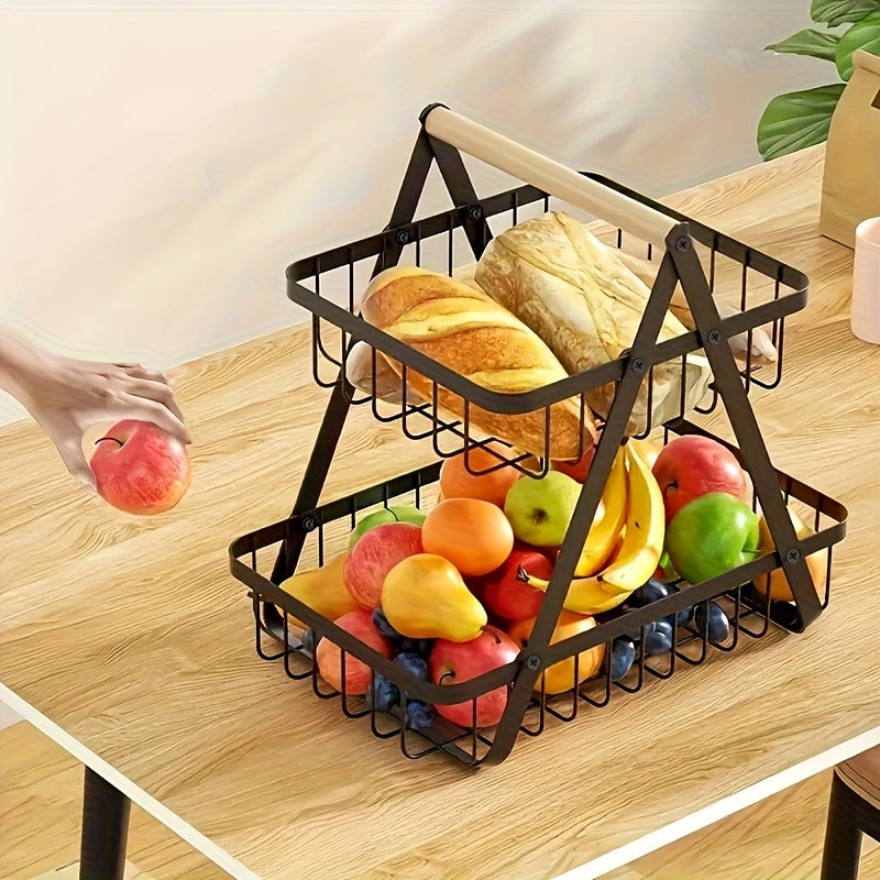 Nutshell Metal Fruit Basket Organiser with two tiers for storing fruits and bread on a wooden table