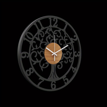 Nutshell metallic black frame clock featuring a decorative tree design and wooden center