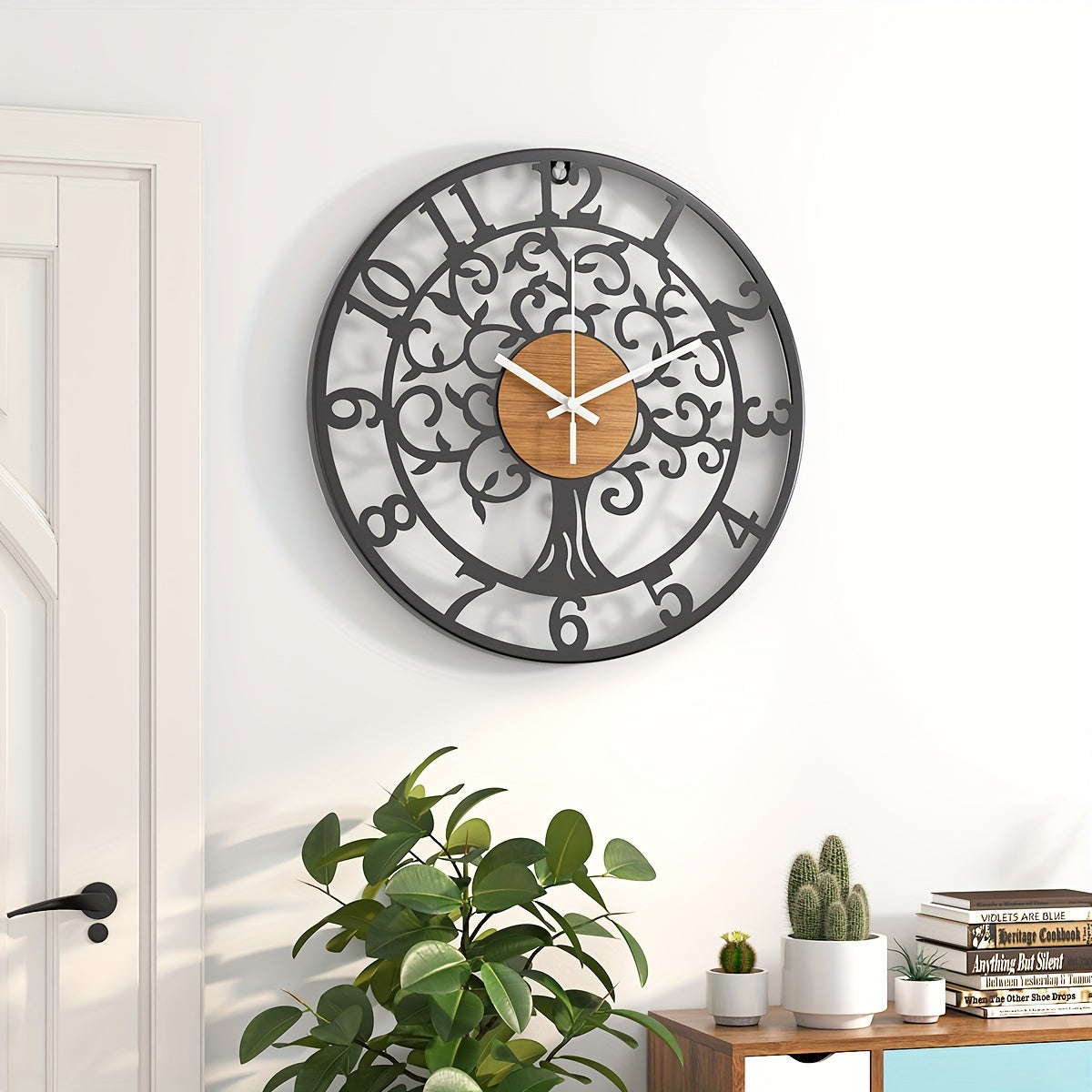 Nutshell metallic black frame clock with a tree design and wooden accents for modern decor