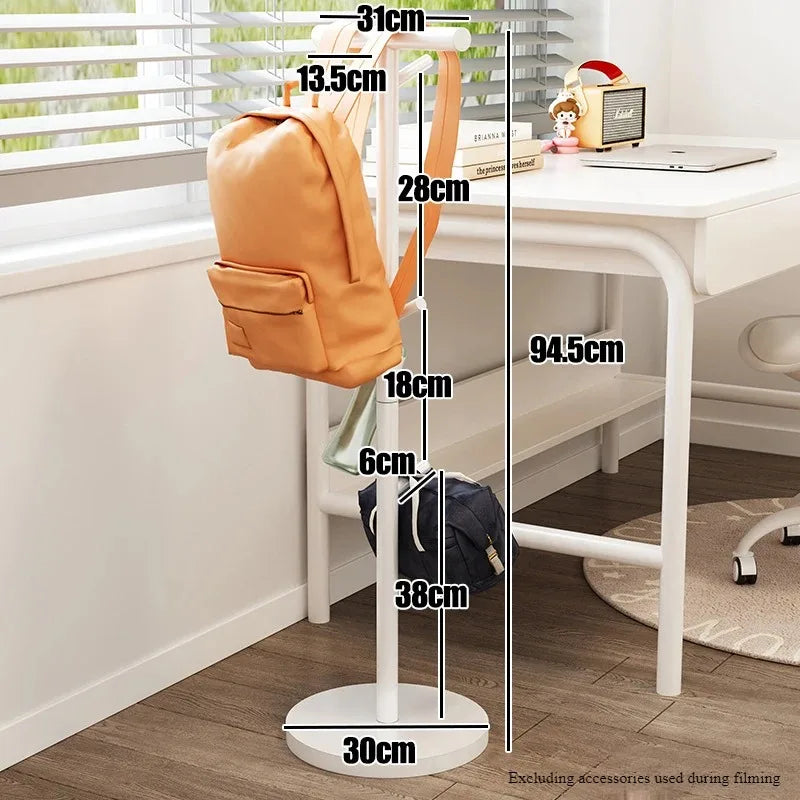 Nutshell white coat stand used as School Bag Storage Rack holding two backpacks beside desk
