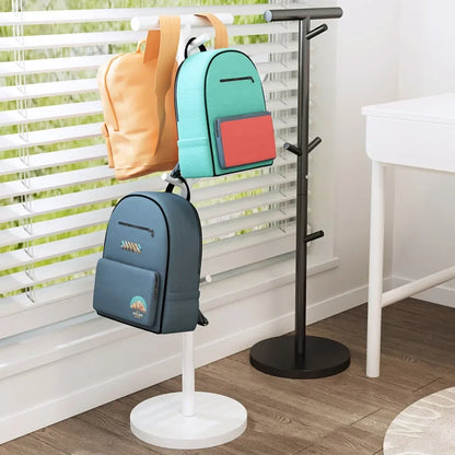 Nutshell coat stand School Bag Storage Rack holding three colorful backpacks in bright entryway
