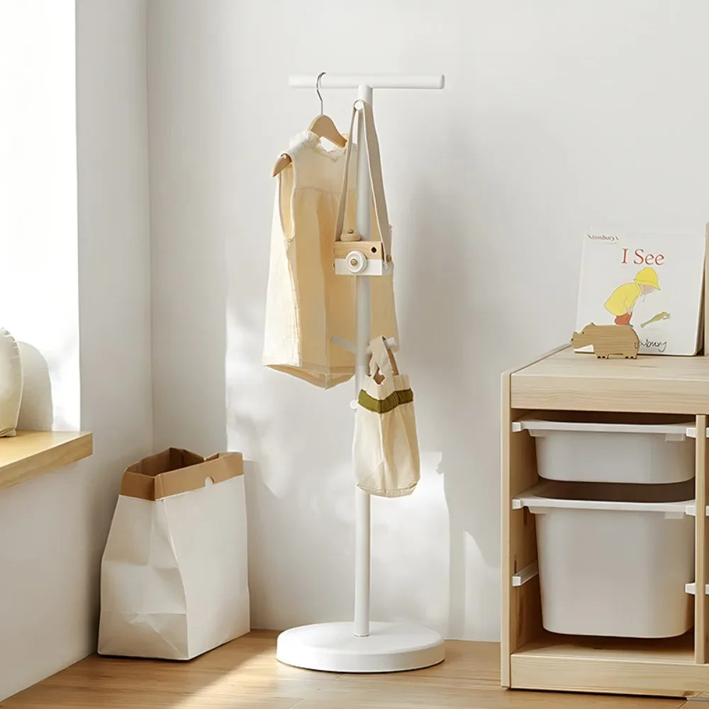 Nutshell white coat stand in a kids room holding coats and totes School Bag Storage Rack for backpacks