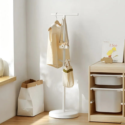 Nutshell white coat stand in a kids room holding coats and totes School Bag Storage Rack for backpacks