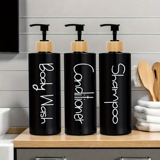 Minimalist bathroom dispenser set featuring black bottles for shampoo, conditioner, and body wash
