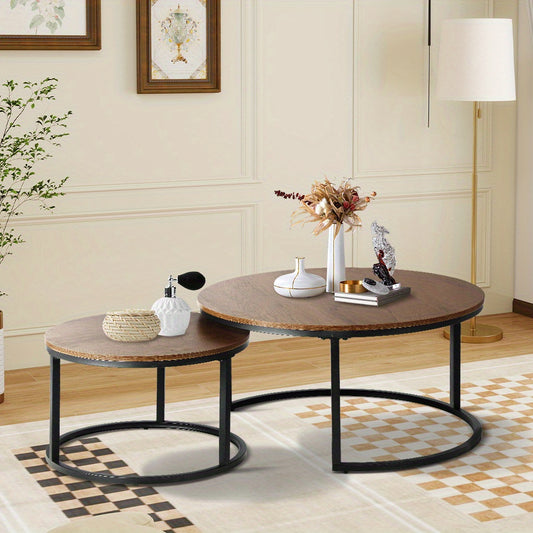 Nutshell 2pcs Round Nesting Coffee Table Set with wood tops and black metal frames in modern living room