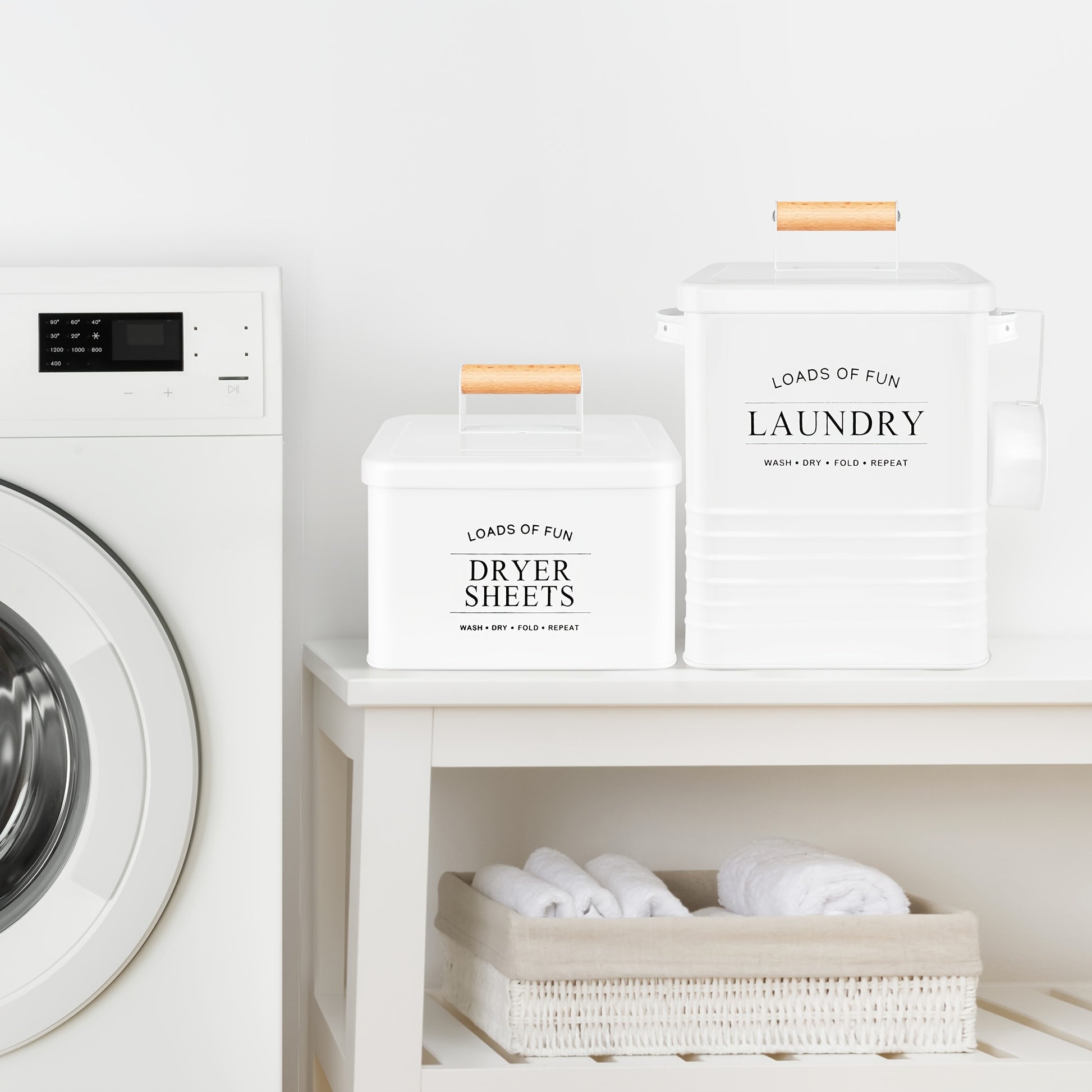 Nutshell modern farmhouse laundry storage containers in white with wooden handles next to a washing machine