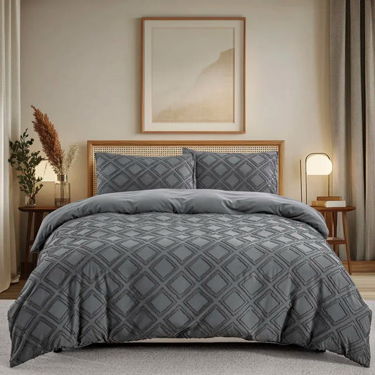 Modern geometric duvet cover in gray with diamond pattern on bed with matching pillowcases