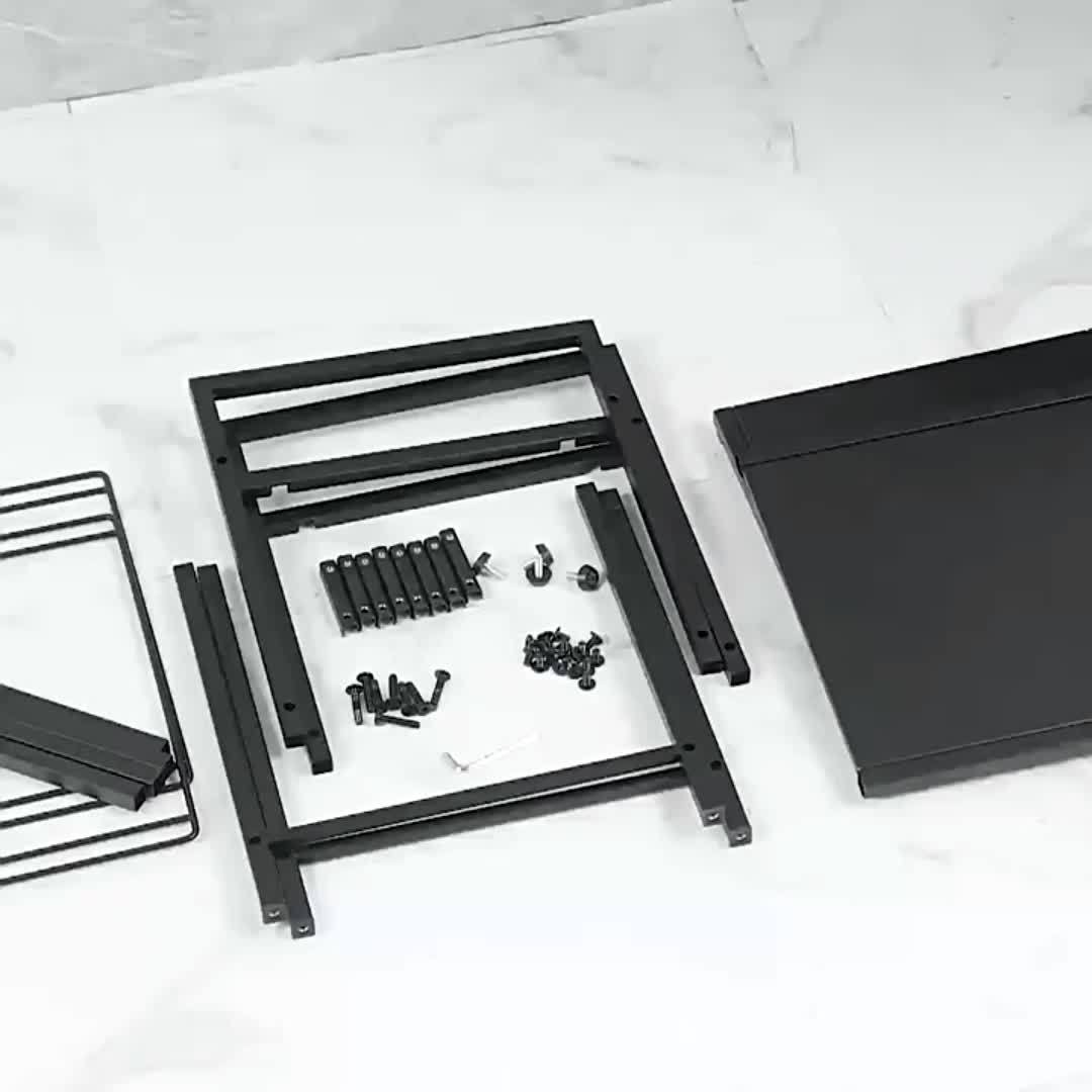 Modern laundry hamper with shelf components neatly arranged, ready for assembly on a marble surface.