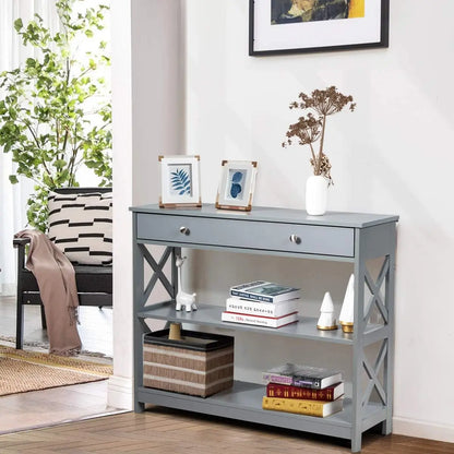 Nutshell Contemporary 3-Tier Console Table . Gray console with drawer X-side supports two open shelves styled with decor