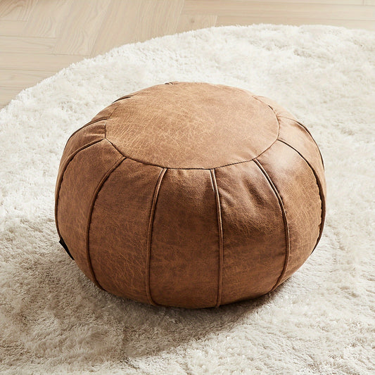 Brown leather Moroccan style ottoman cover with a round shape, perfect for home decor and comfort