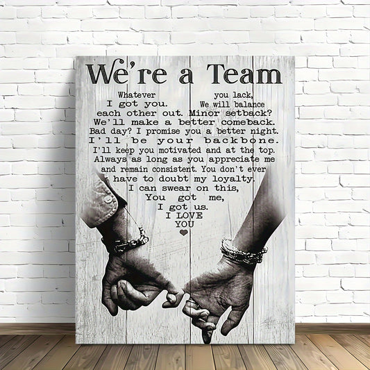 Motivational wall art decor featuring hands holding with an inspiring team message on a distressed wood background