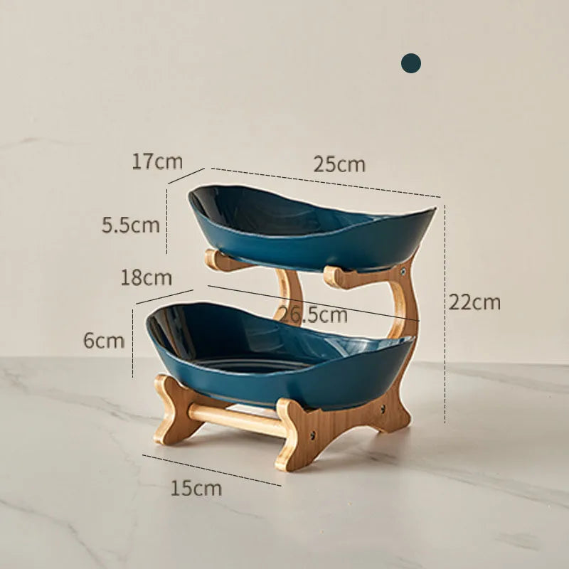 Nutshell multi-tier serving stand with two blue ceramic fruit bowls on wooden frame