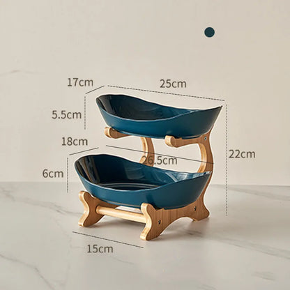 Nutshell multi-tier serving stand with two blue ceramic fruit bowls on wooden frame