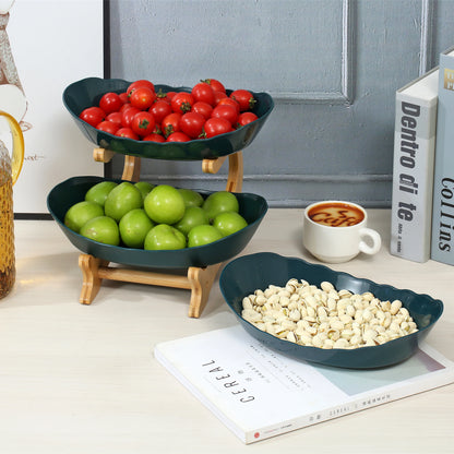 Nutshell fruit bowl featuring a multi-tier serving stand with green apples and cherry tomatoes