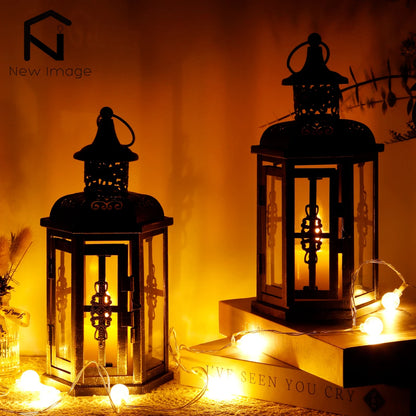 Nutshell vintage candle holder lanterns with intricate metal design glowing warmly in dim lighting