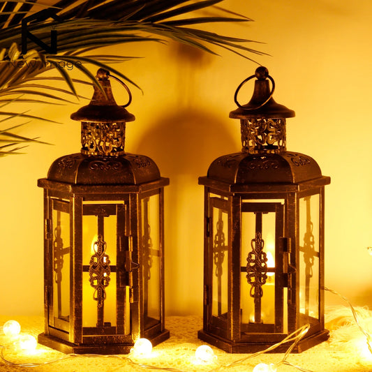 Nutshell vintage candle holder lanterns in black metal with intricate designs and glass panels