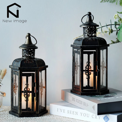 Nutshell vintage candle holder lanterns with intricate metal design and glass panels displayed on books