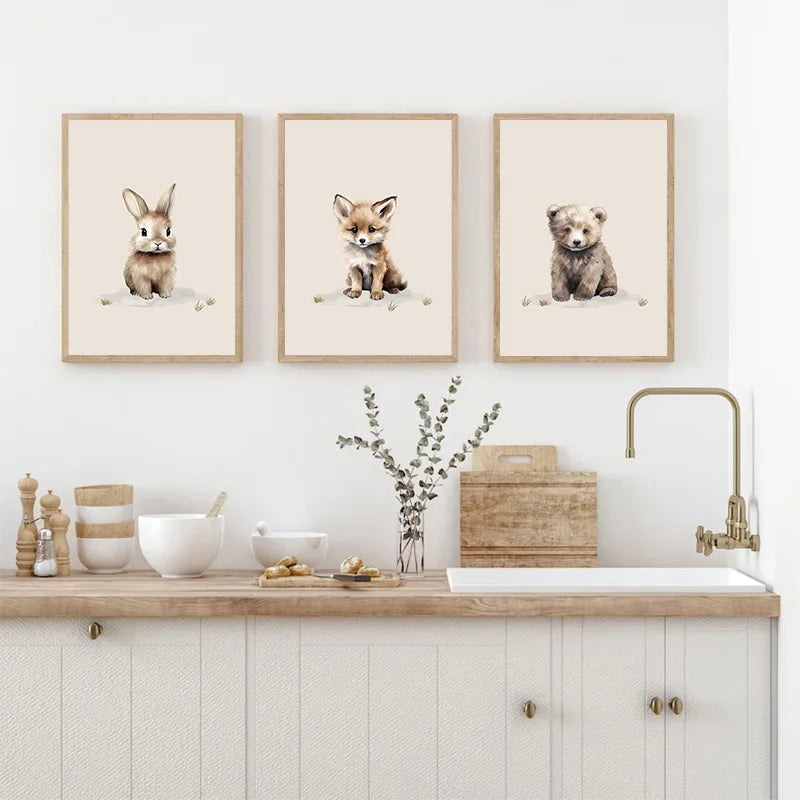 Three framed Nordic animal wall art for kids featuring a bunny, fox, and bear in a stylish home setting