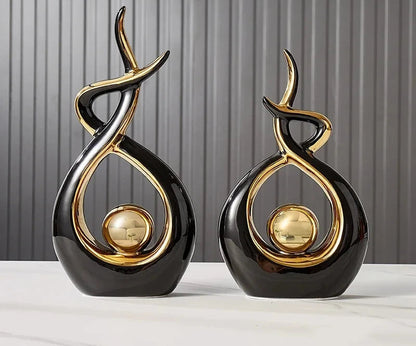 Nutshell black and gold vases shaped as abstract Nordic home decor figurines for modern interiors