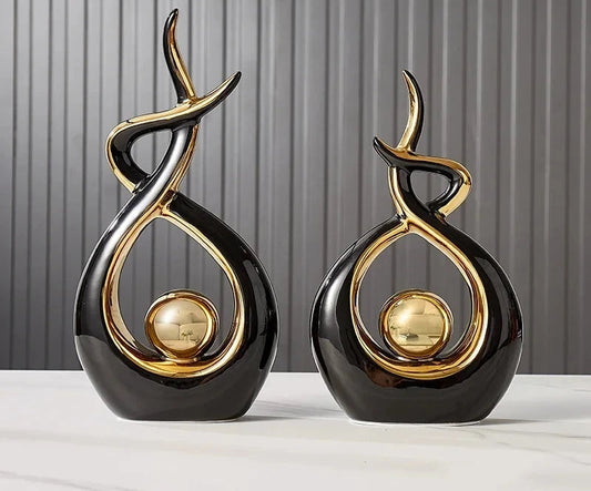 Nutshell black and gold vases shaped as abstract Nordic home decor figurines for modern interiors