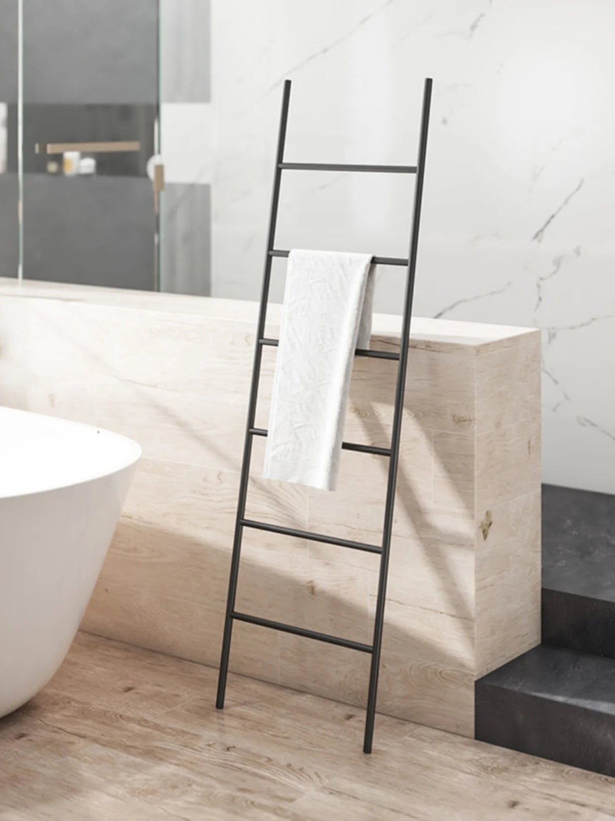 Nordic Style Towel Rack Ladder in Black with a White Towel for Modern Bathrooms