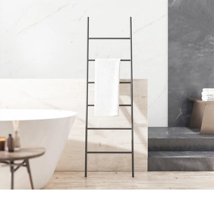 Nordic Style Towel Rack Ladder in Black Metal Holding a White Towel for Bathroom Decor