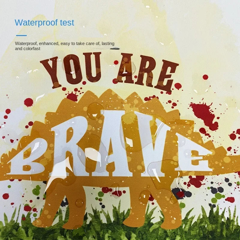 Colorful nursery wall art for boys featuring a dinosaur and motivational text you are brave