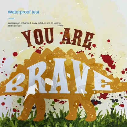 Colorful nursery wall art for boys featuring a dinosaur and motivational text you are brave