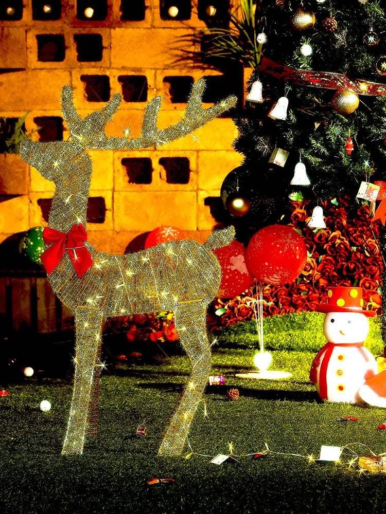 Nutshell outdoor Christmas deer decorations illuminated with lights and festive accents for holiday cheer