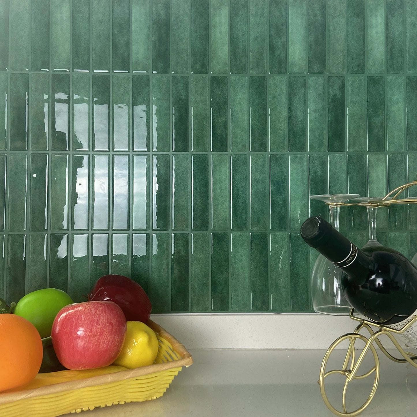 Green glossy vertical subway DIY Backsplash Tiles in kitchen with fruit basket and wine bottle staging